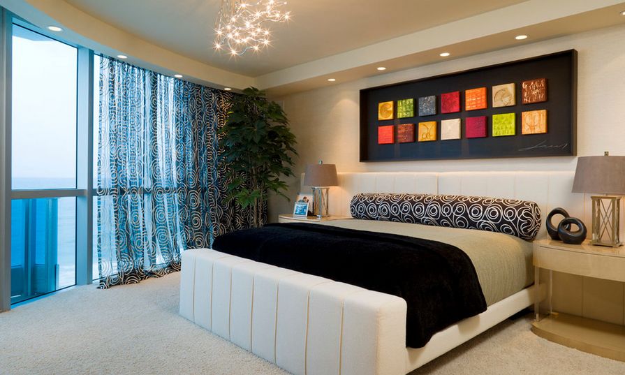 Colorful art above the bed