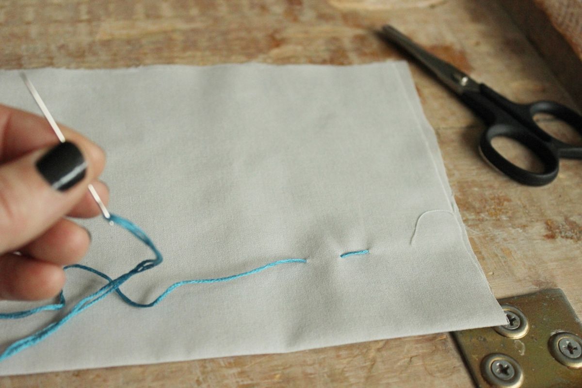 How to Sew - Pull the thread all the way through and taut.
