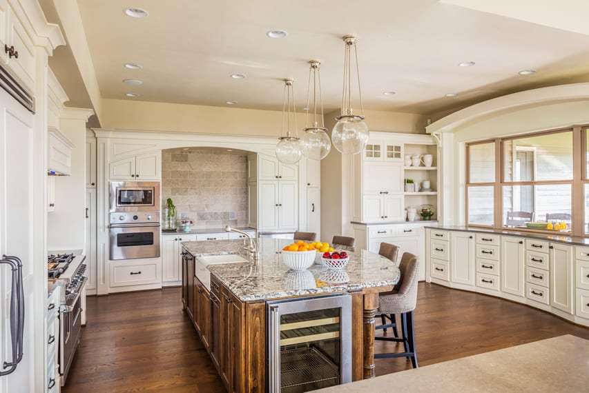 Contemporary white kitchen with large dining island