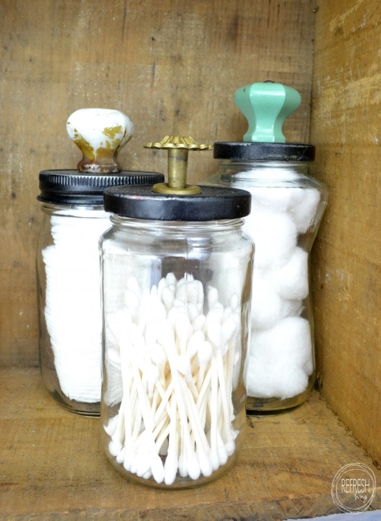 three glass jars used in bathroom for beautiful bathroom storage.