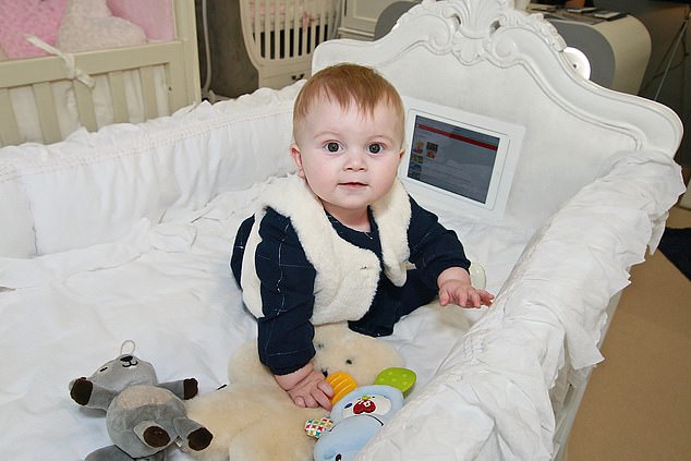 The idea came about after Mr Taylor wanted to use iPad apps to play ‘white noise’ to his nine-month-old daughter, Graysie, to help her sleep. But the idea grew to provide in-cot, swipeable entertainment next to the little one’s head at a cost of £2,000 per mahogany ‘Florence’ crib