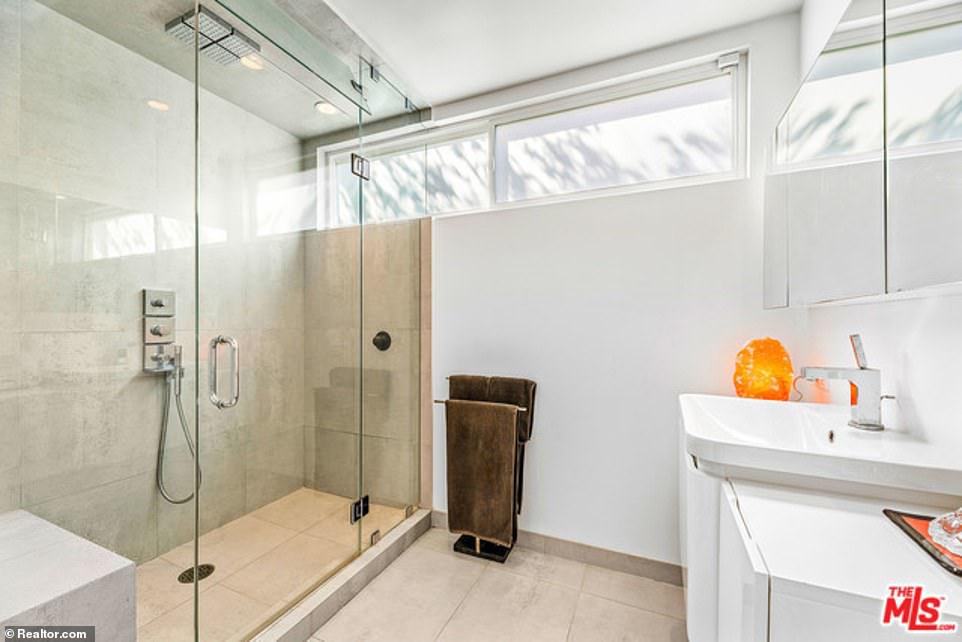 Other features include updated bathrooms, built-in shelving and a walk-in closet and an open living room and dining area