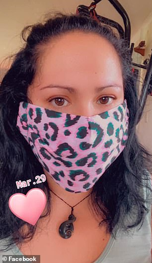 A woman wears a homemade face mask sewn from a Kmart tea towel