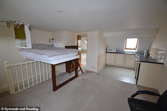 The unusual property in Worthing, West Sussex, was put on real estate site OnTheMarket and listed for £125,000 but Twitter users were left confused by the bizarre bed frame that had been created and attached to the wall above the stairs