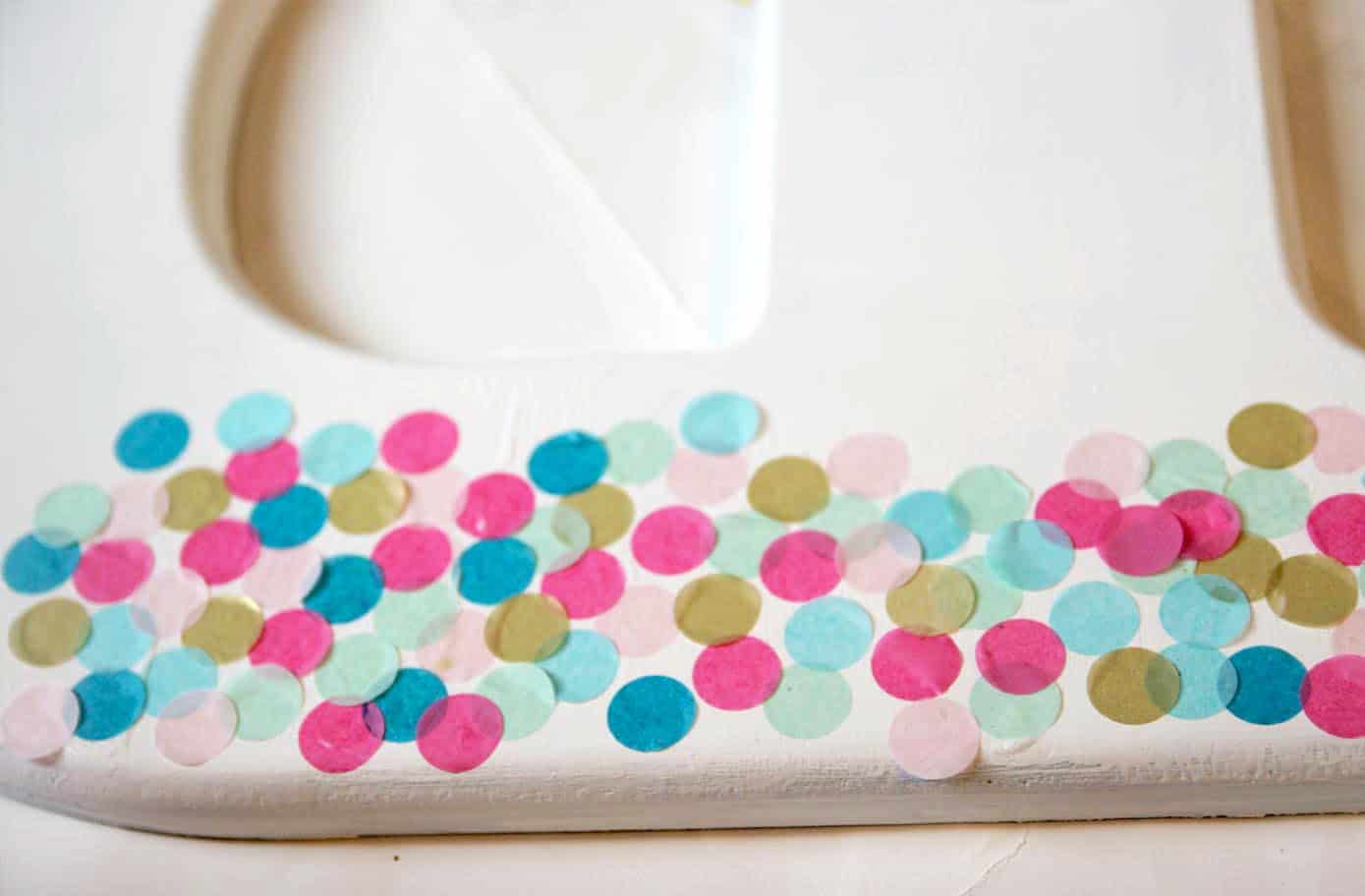 Learn how to make decorative letters using confetti and Mod Podge! This project is perfect for a kids