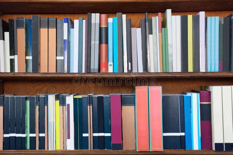 Books on the shelves of a library stock photos