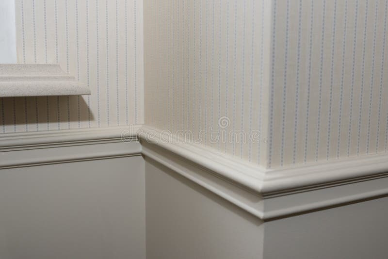 Ceiling moldings in the interior, detail of a angular wall skirting. stock images Ceiling moldings in the interior, detail of a angular wall skirting. stock images