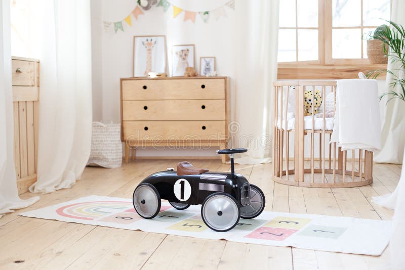 Chalet Baby Bedroom Interior with Cozy Cradle Bed. Light Brown Childish Room with Wooden Cot. Cosy Home Hygge Style Design. Modern stock photography