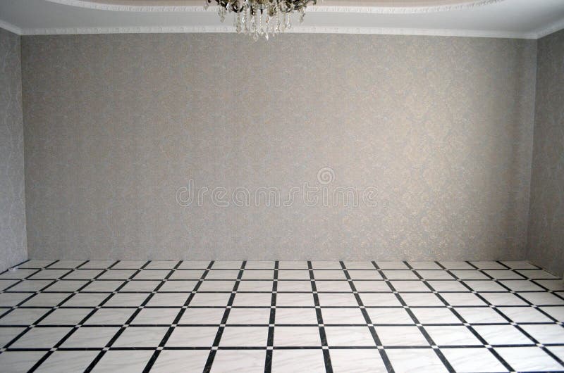 Classic empty interior with a light wall, stone tiles on the floor, curtain, decor, ceiling, skirting and a large beautiful. Chandelier stock photo