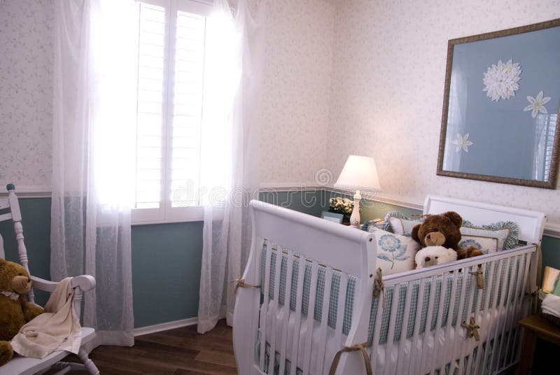 A crib in a baby room interior stock photography