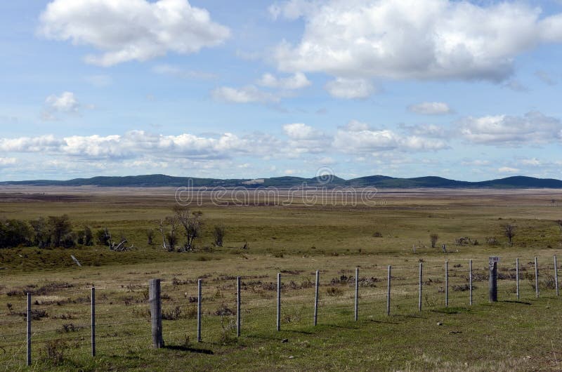Fenced private plot of land in Tierra del Fuego. TIERRA DEL FUEGO, CHILE - NOVEMBER 13,2014:Fenced private plot of land in Tierra del Fuego stock image