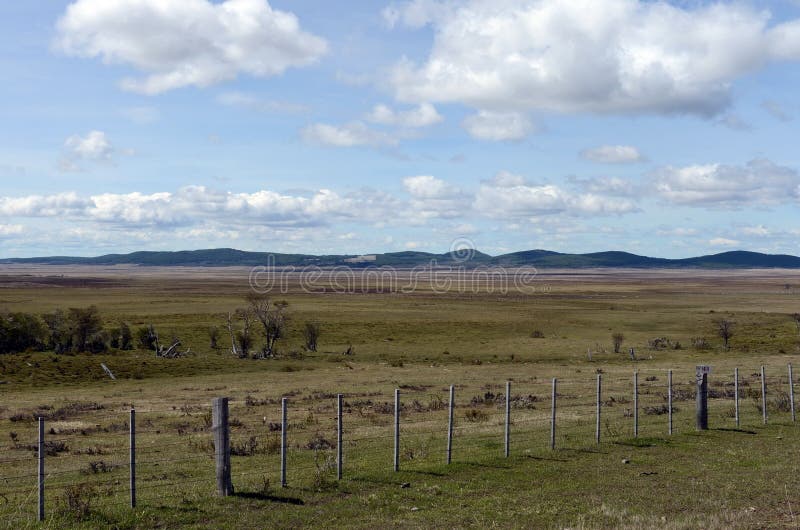 Fenced private plot of land in Tierra del Fuego. TIERRA DEL FUEGO, CHILE - NOVEMBER 13,2014:Fenced private plot of land in Tierra del Fuego stock image Fenced private plot of land in Tierra del Fuego. TIERRA DEL FUEGO, CHILE - NOVEMBER 13,2014:Fenced private plot of land in Tierra del Fuego stock image