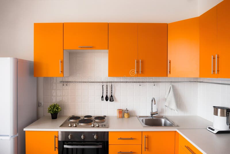 Modern orange kitchen stock images