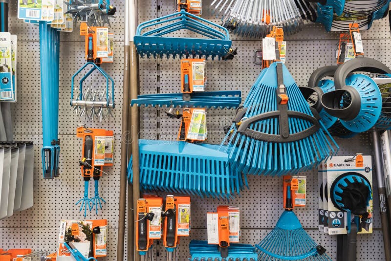 ST. PETERSBURG, RUSSIA - MARCH, 2019: shelf of a garden shop with the tools to care for a plot of land works stock photos