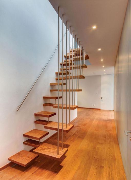 projects stairs to the second floor with their hands